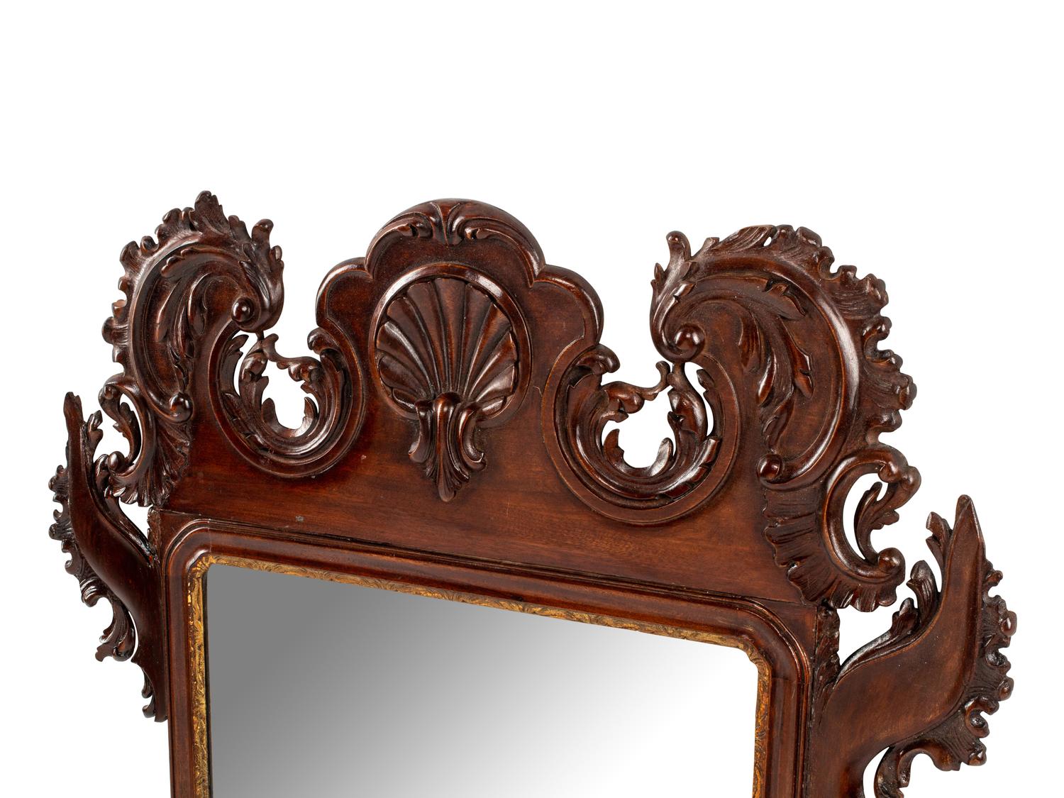 A George III Style Carved and Parcel Gilt Mahogany Mirror