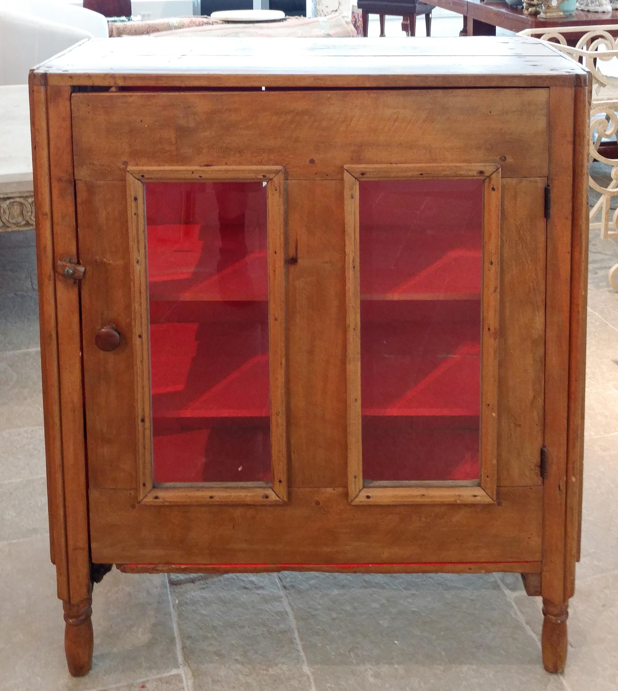 A Pine Single-Door Glazed Cabinet Height 40 1/4 x width 34 1/4 inches.