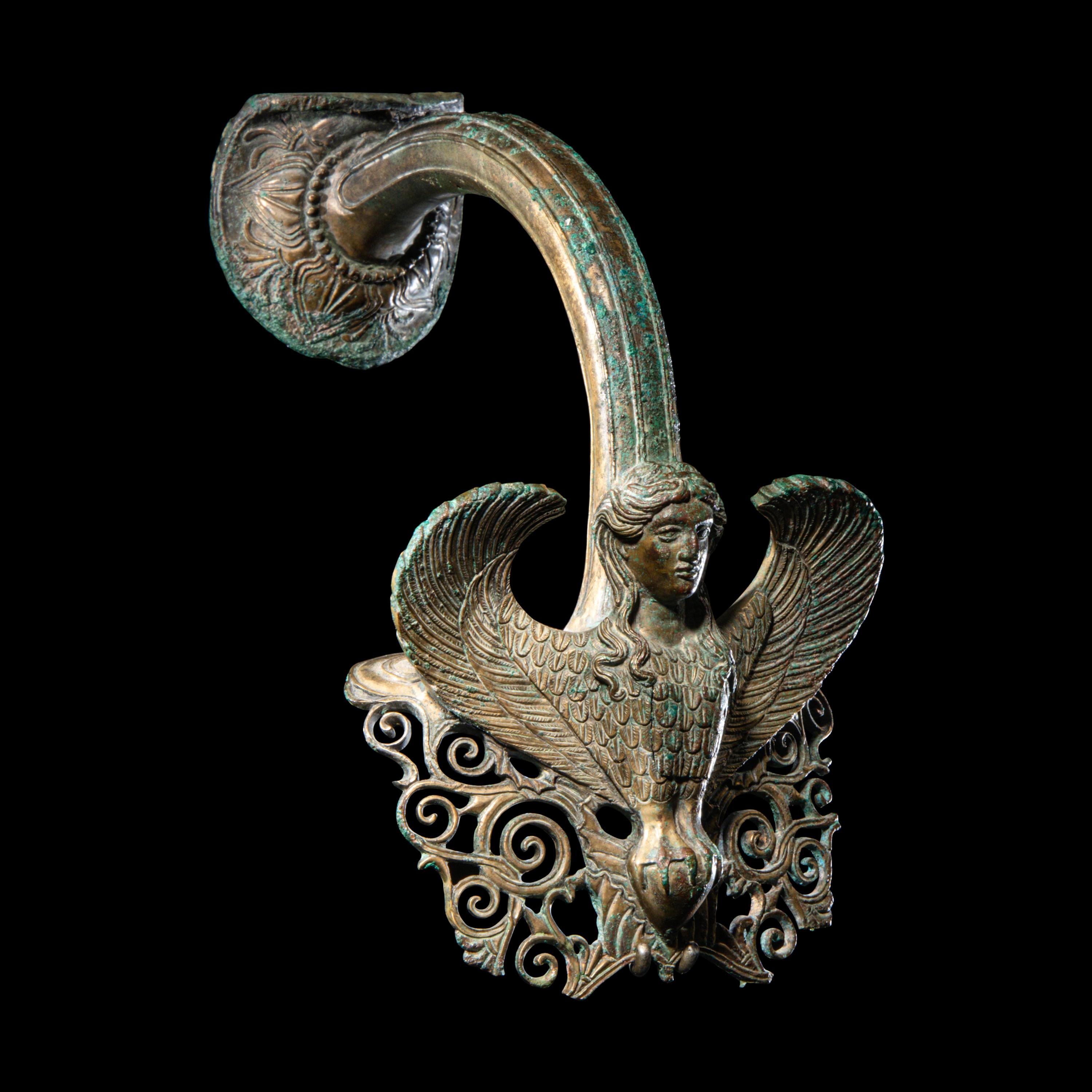 A Greek Bronze Hydria Handle with a Siren