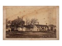 [CIVIL WAR -- ENSLAVEMENT]. CDV of a slave pen "Now used for a Guard House for U. S. Soldiers." Alexandria, VA: Bowdoin, Taylor & Co., ca 1862.