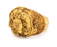 A High Karat Yellow Gold Bacchus Motif Ring, 14.20 dwts.