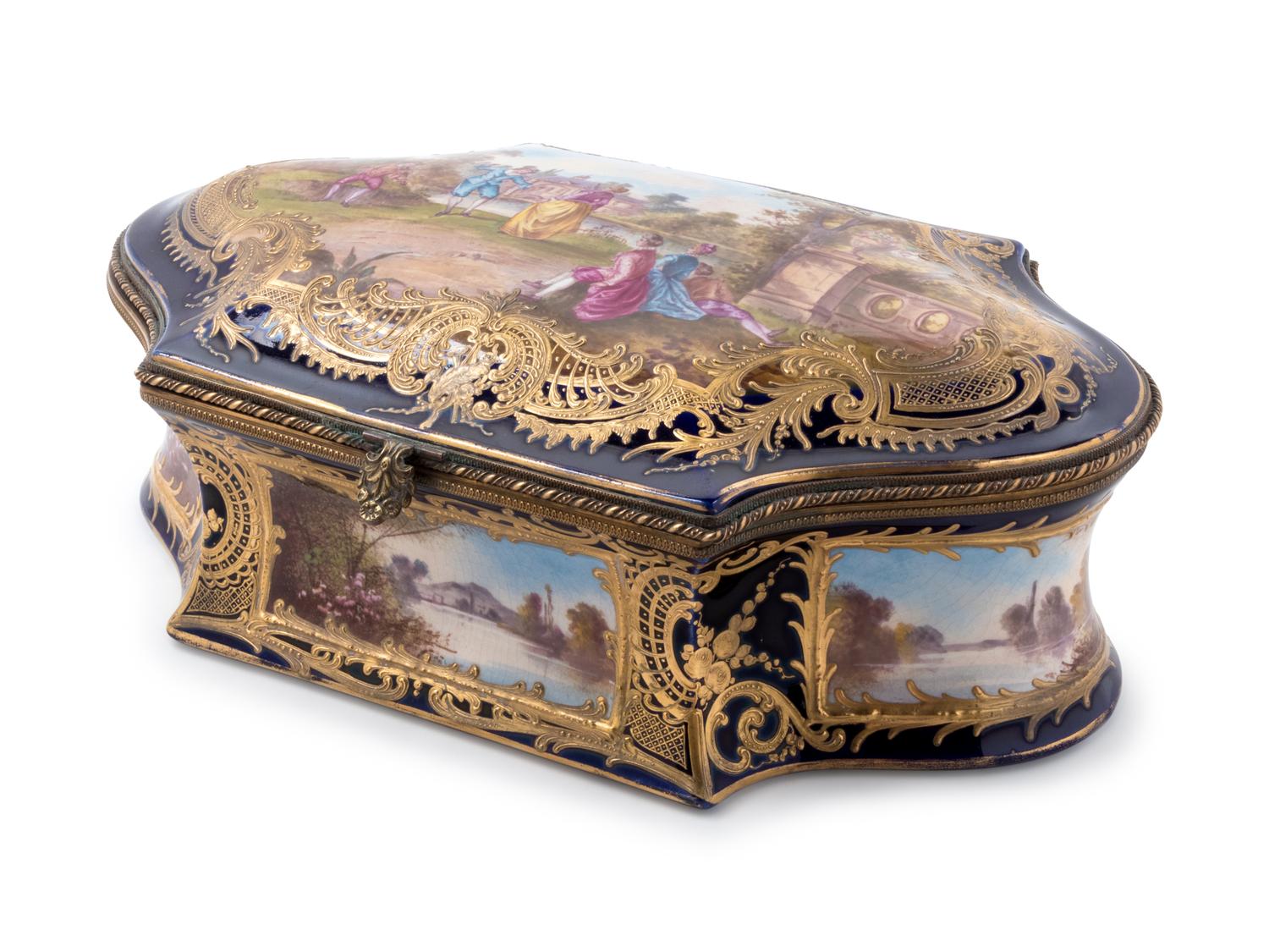 A Sèvres Style Painted and Parcel Gilt Porcelain Table Casket