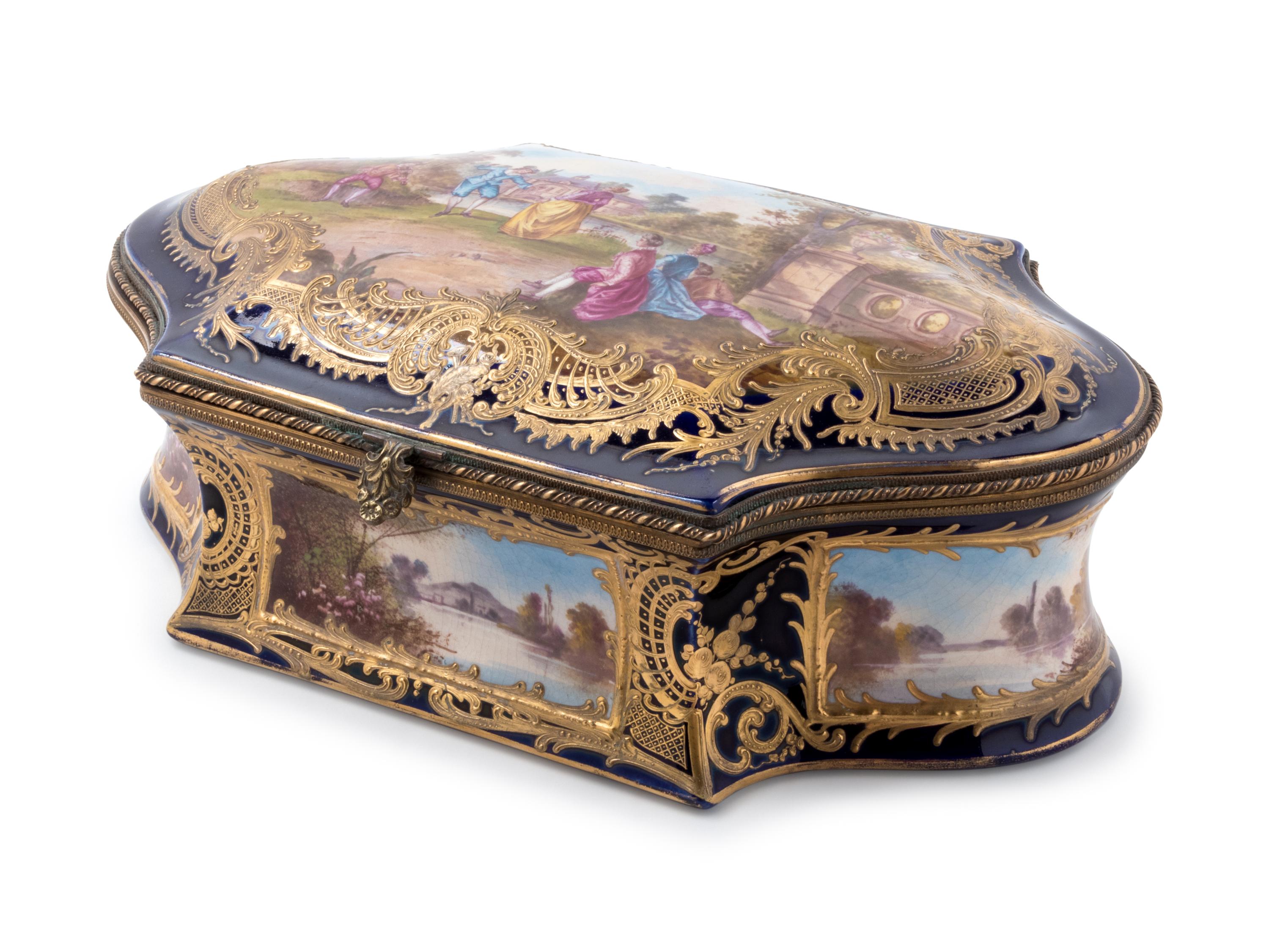 A Sèvres Style Painted and Parcel Gilt Porcelain Table Casket