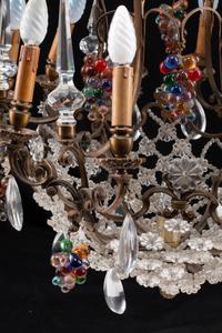 A Louis XV Style Patinated Bronze, Cut and Colored Glass Fourteen-Light Chandelier