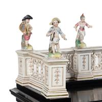 A German Ebonized and Porcelain Mounted Bureau