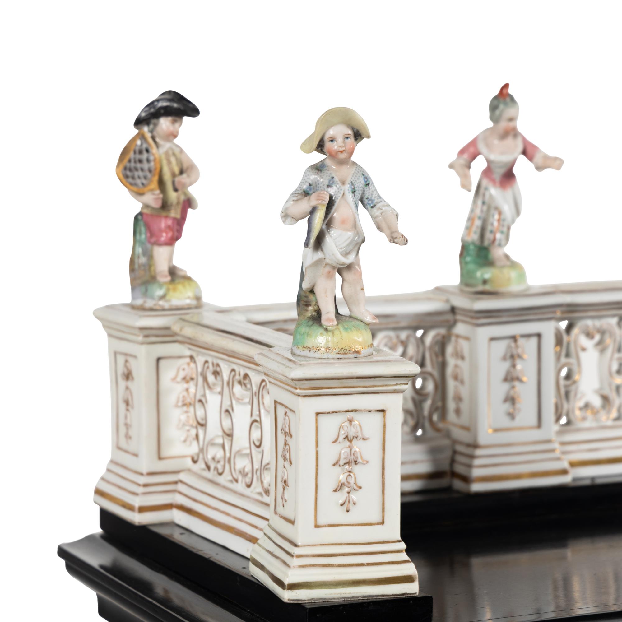 A German Ebonized and Porcelain Mounted Bureau