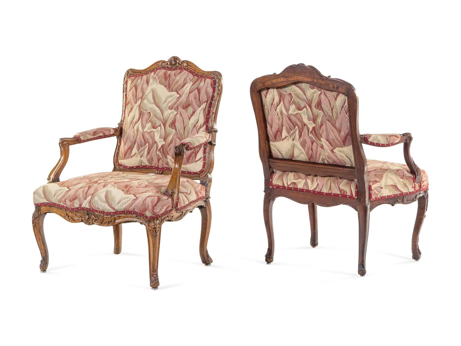 A Pair of Louis XV Walnut Fauteuils