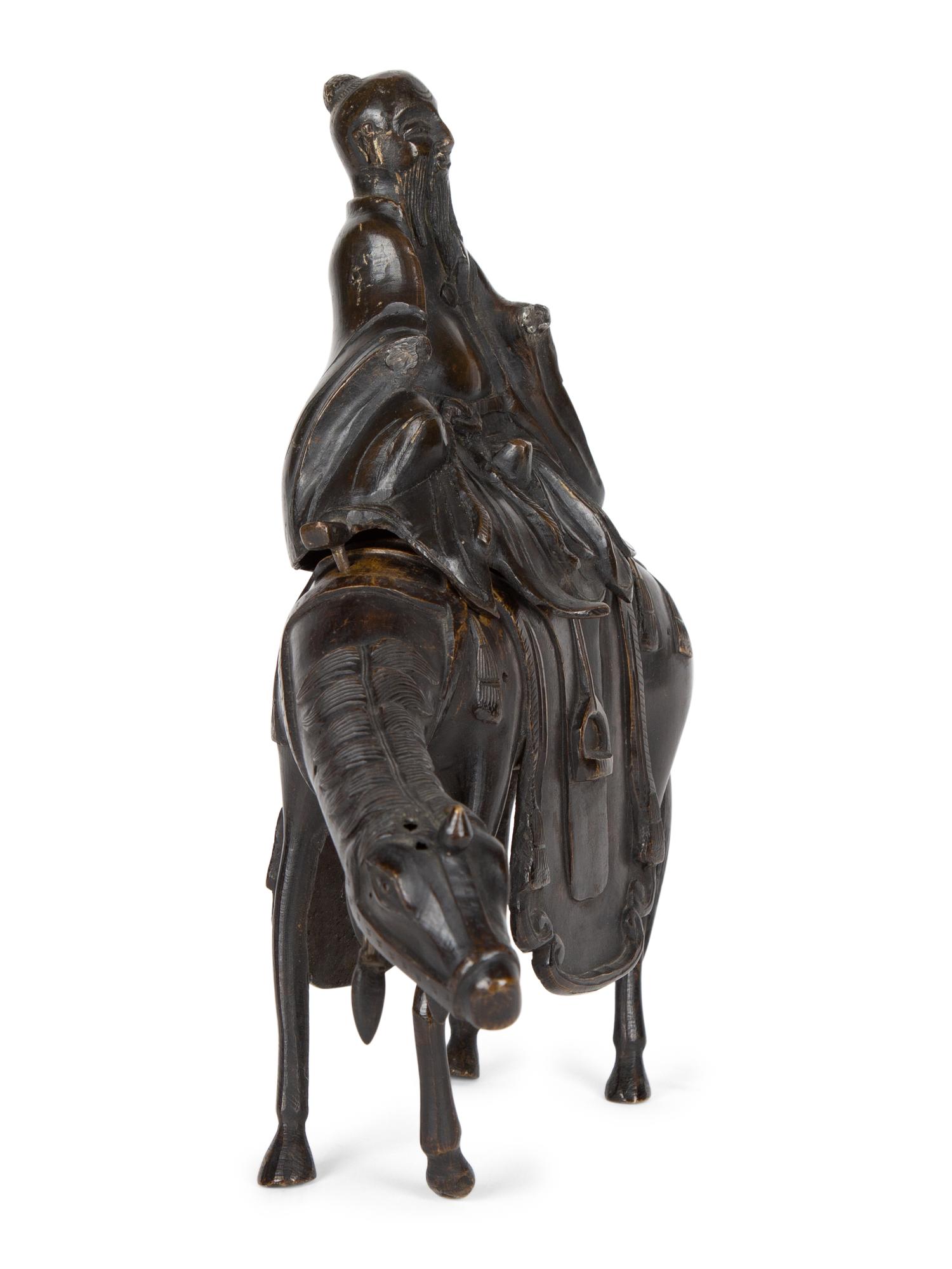 A Chinese Bronze Figure of Shoulao on Horseback — 20TH CENTURY