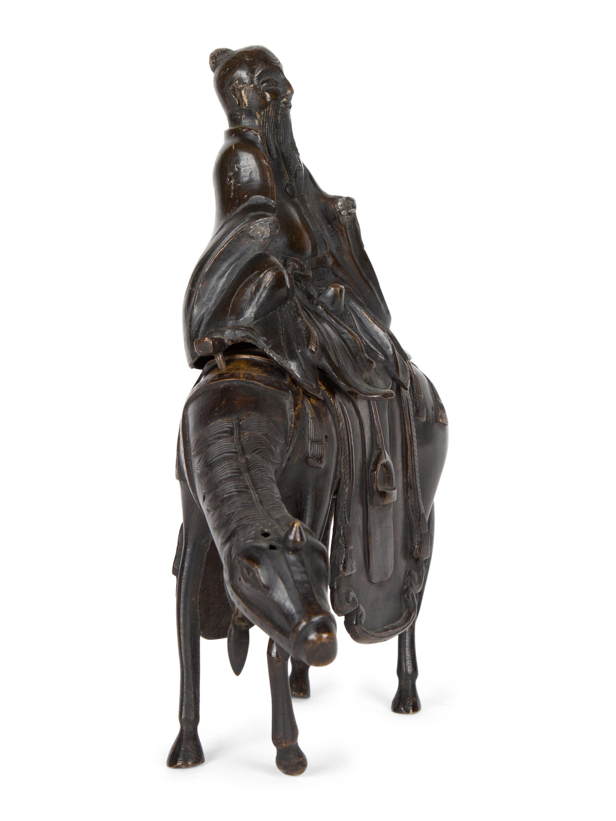 A Chinese Bronze Figure of Shoulao on Horseback — 20TH CENTURY