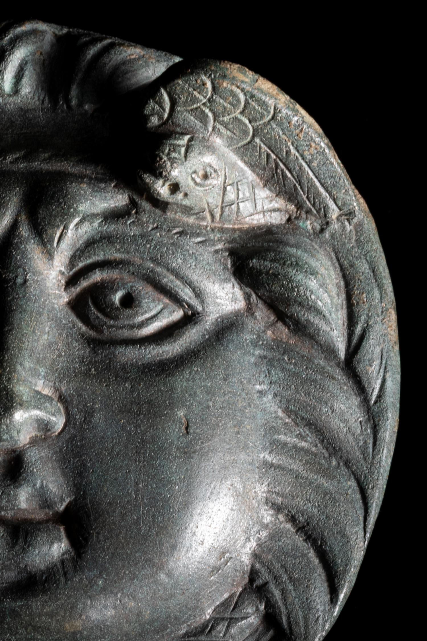 A Roman Bronze Roundel with Head of a Gorgon