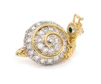 A Bicolor Gold, Diamond and Emerald Snail Brooch, 5.90 dwts.