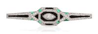 An Art Deco Platinum, Diamond, Onyx and Emerald Bar Brooch, French, 7.40 dwts.