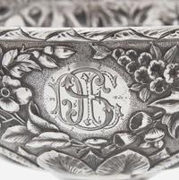A sterling silver floral repoussé footed bowl and stand Peter L. Krider Co., Philadelphia, PA and Gorham Mfg. Co., Providence, RI, dated "1878," and 1897-1899, respectively