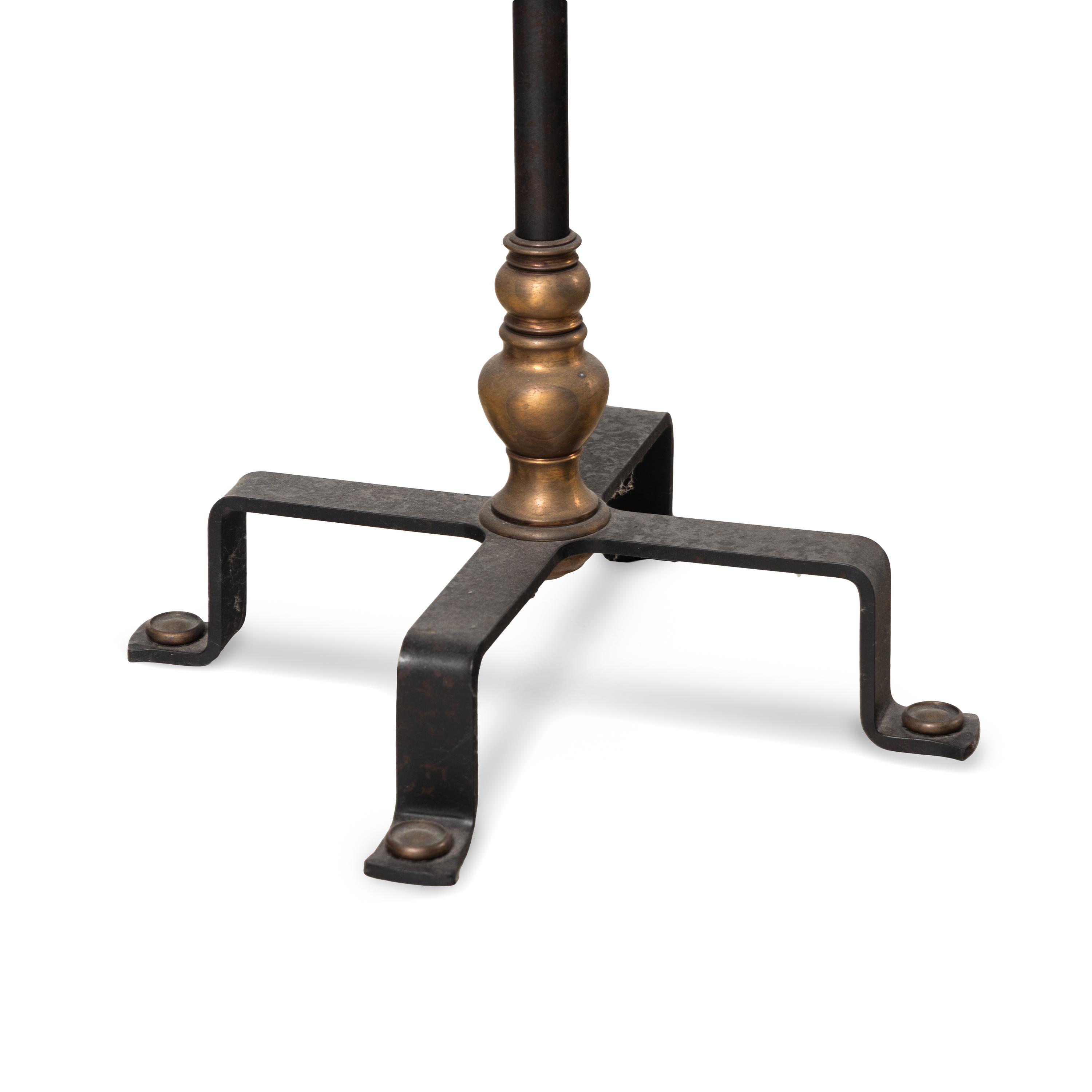 An Iron and Bronze Floor Lamp