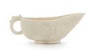 A Chinese Blanc-de-Chine Porcelain Libation Cup Length 5 1/2 inches. — 17TH CENTURY