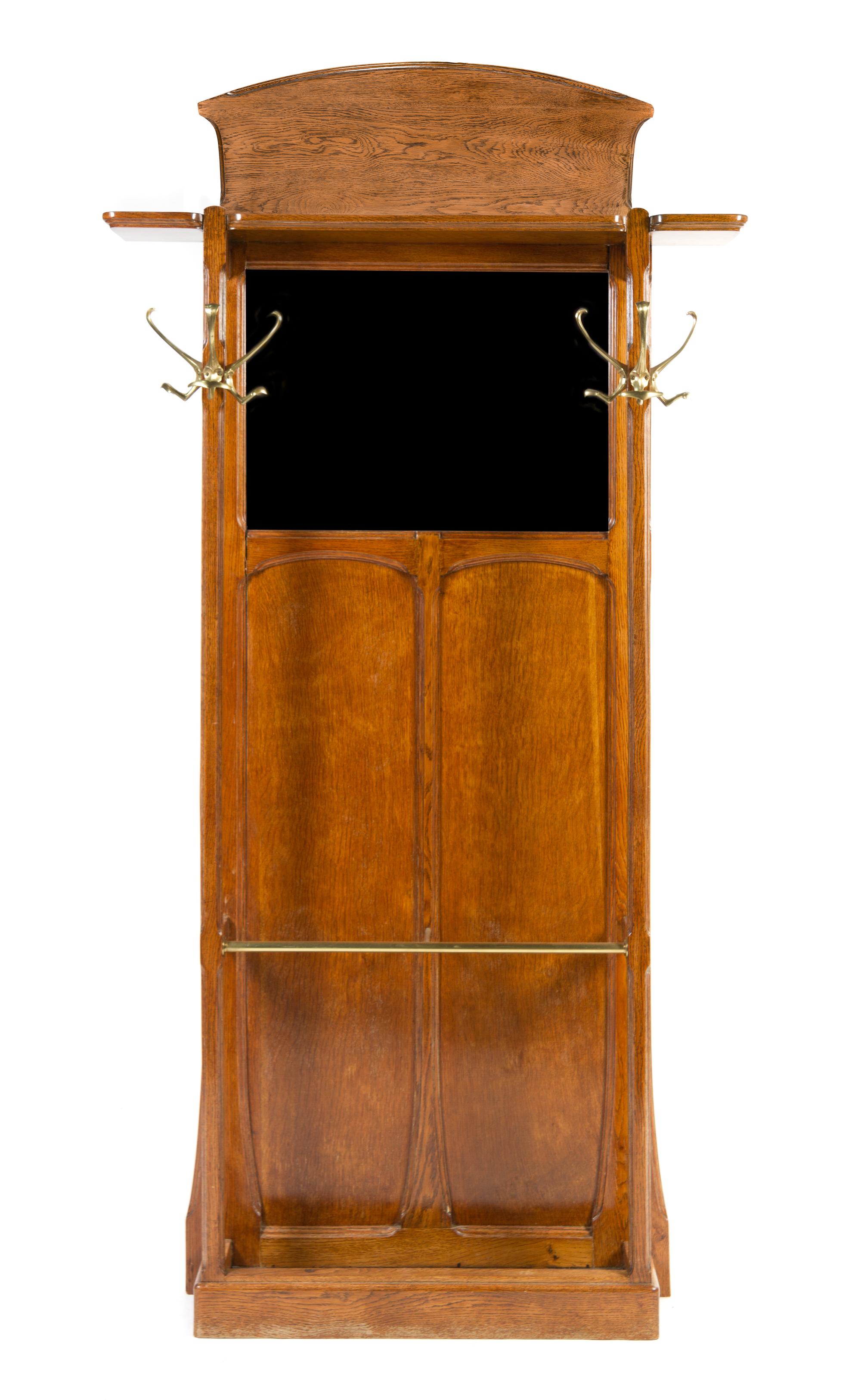 A French Art Nouveau Oak Hall Stand, School of Nancy Height 74 1/2 x width 43 x depth 8 inches.