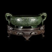 A Chinese Carved Spinach Jade Marriage Bowl, Late Qing/Republic Period 晚清/民國 碧玉雙魚活環洗