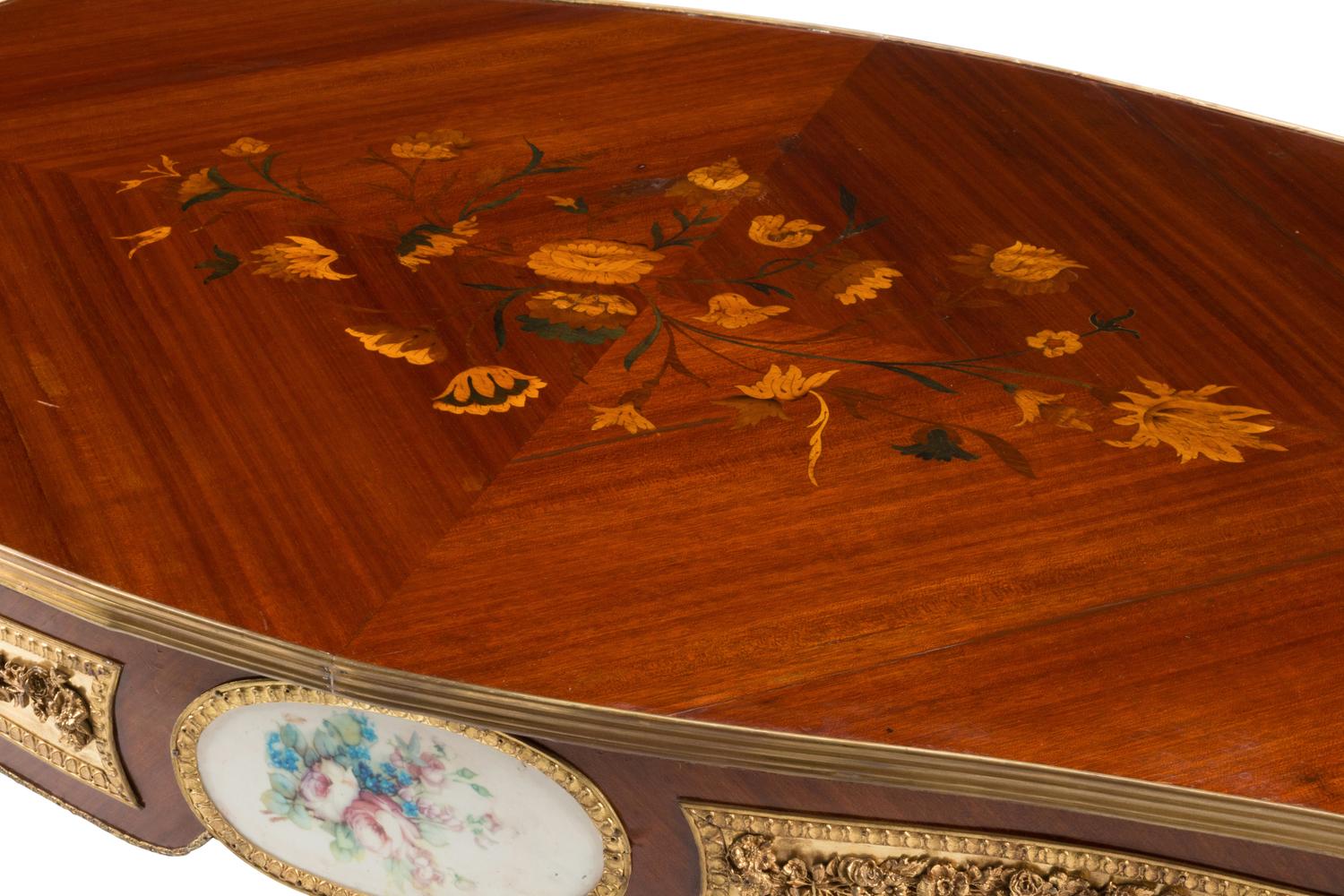 A Louis XV Style Gilt Bronze and Porcelain Mounted Low Table