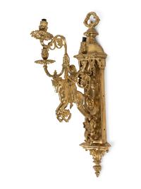 A Pair of Gothic Style Brass Three-Light Sconces