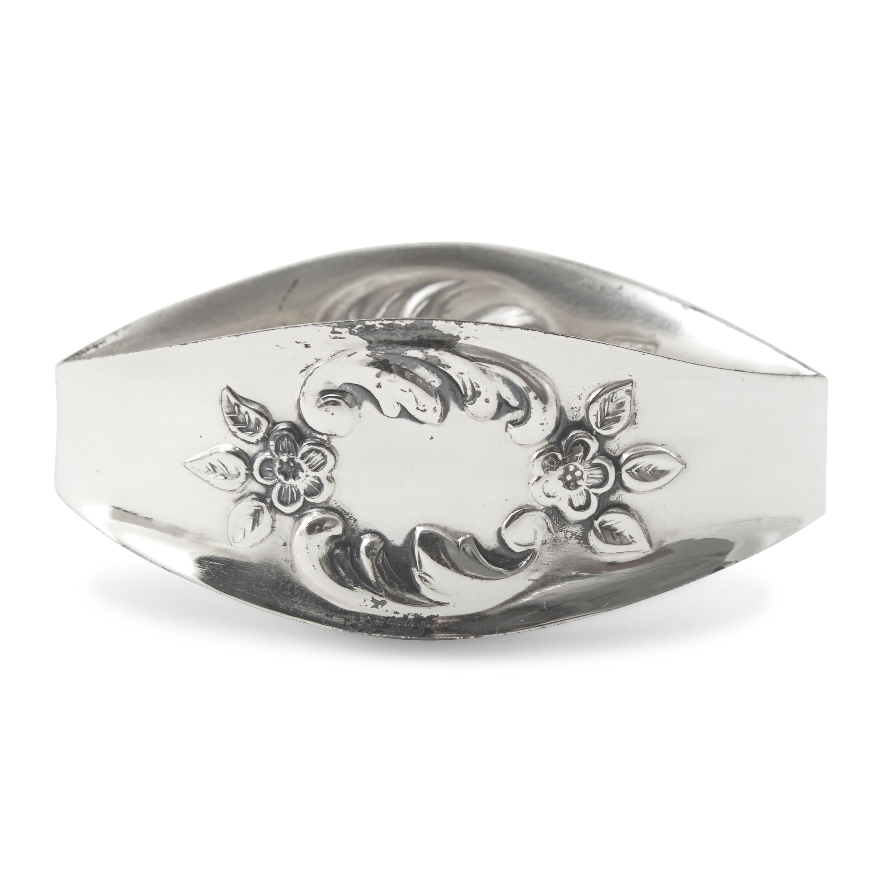 A Set of Twelve German Silver Napkin Rings