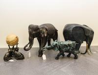 A Group of Four Cast Metal Elephant Figures Height of tallest 11 inches.