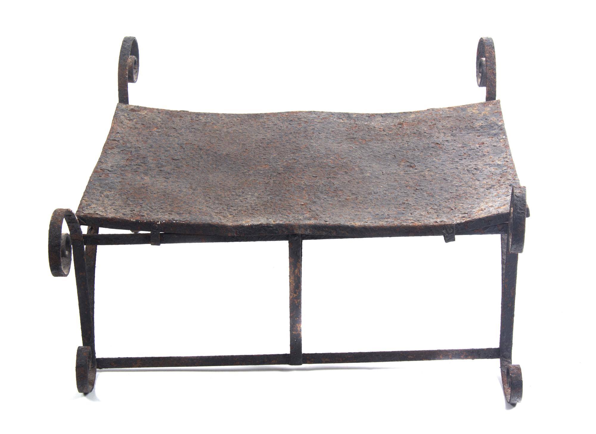 An Iron Stool or Low Table rHeight 11 1/2 inches x width 24 1/2 inches x depth 16 1/2 inches.