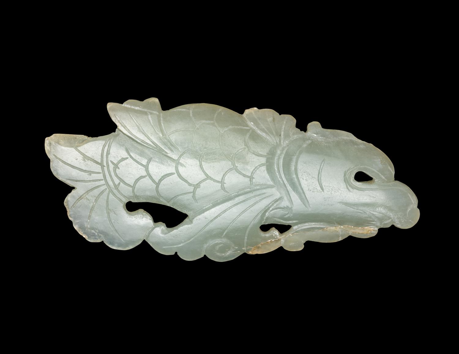 A Chinese Celadon Jade Carving of a Dragon-Carp