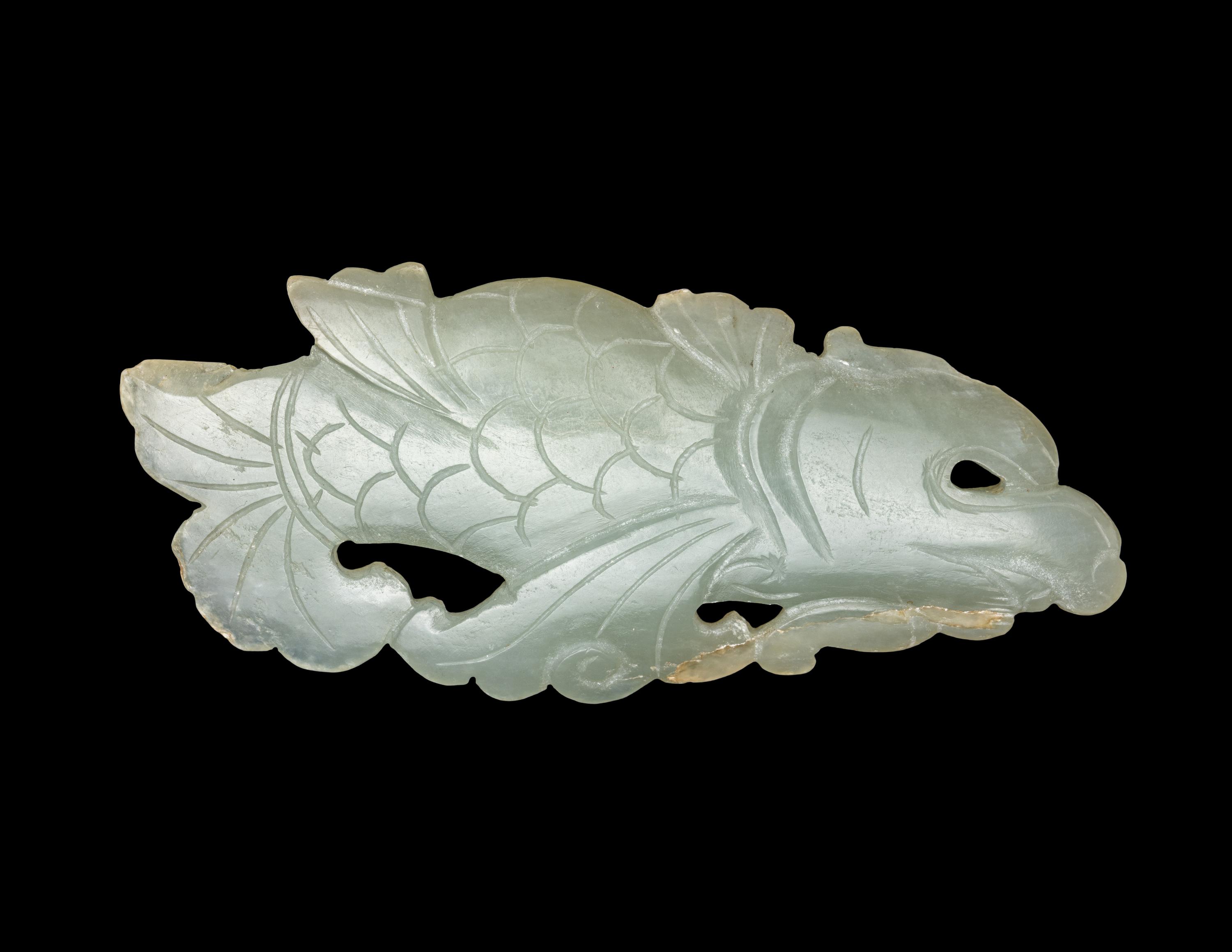 A Chinese Celadon Jade Carving of a Dragon-Carp