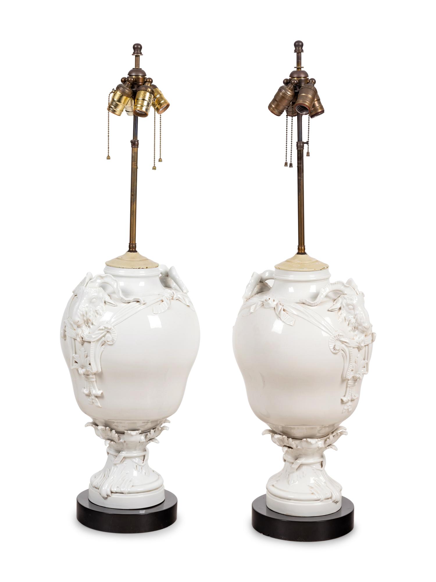 A Pair of German Blanc-de-Chine Porcelain Urns Mounted as Lamps