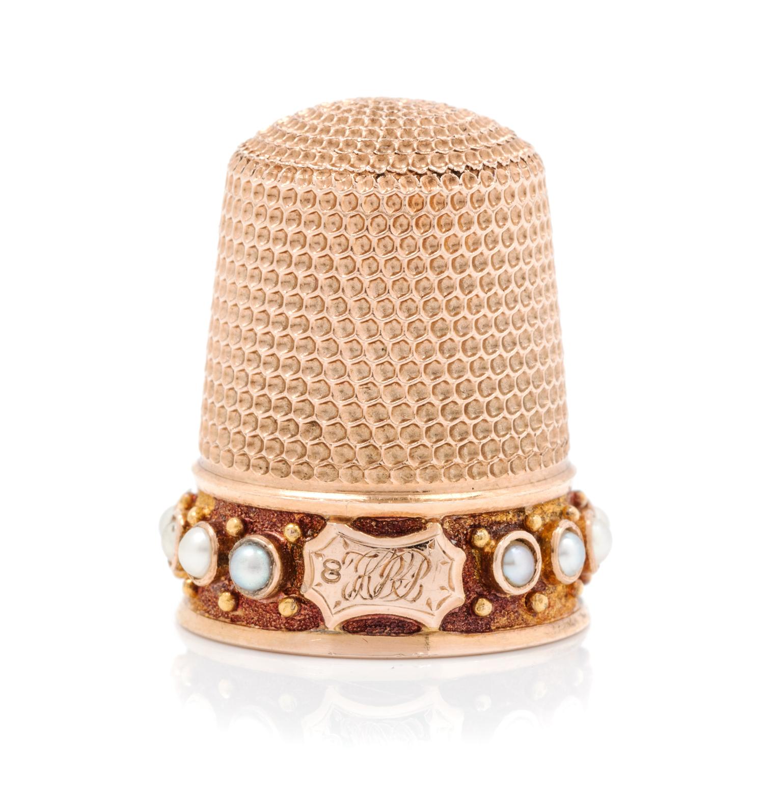An American 14-Karat Rose Gold and Pearl Thimble, Simons Bros., Philadelphia, PA, the knurled top and body above a pearl inset band wit