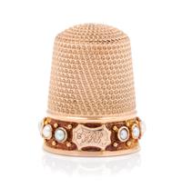 An American 14-Karat Rose Gold and Pearl Thimble, Simons Bros., Philadelphia, PA, the knurled top and body above a pearl inset band wit
