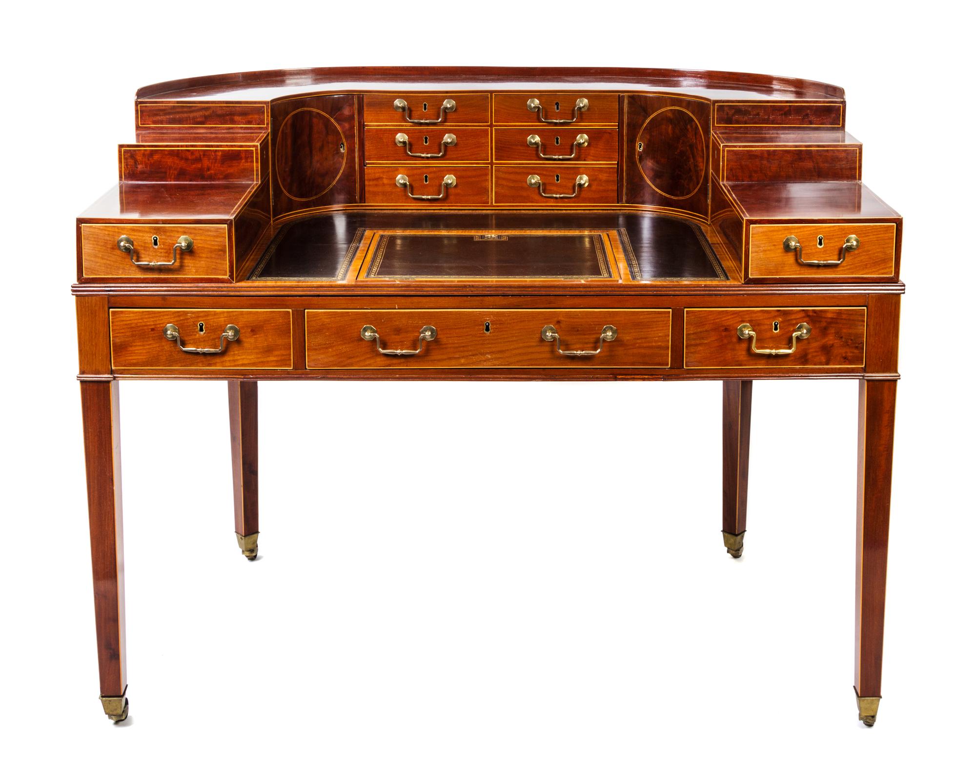 A George III Gilt-Tooled Leather-Inset, Inlaid Mahogany and Satinwood-Banded Carlton House Desk Height 41 x width 53 1/2 x depth 33 inc