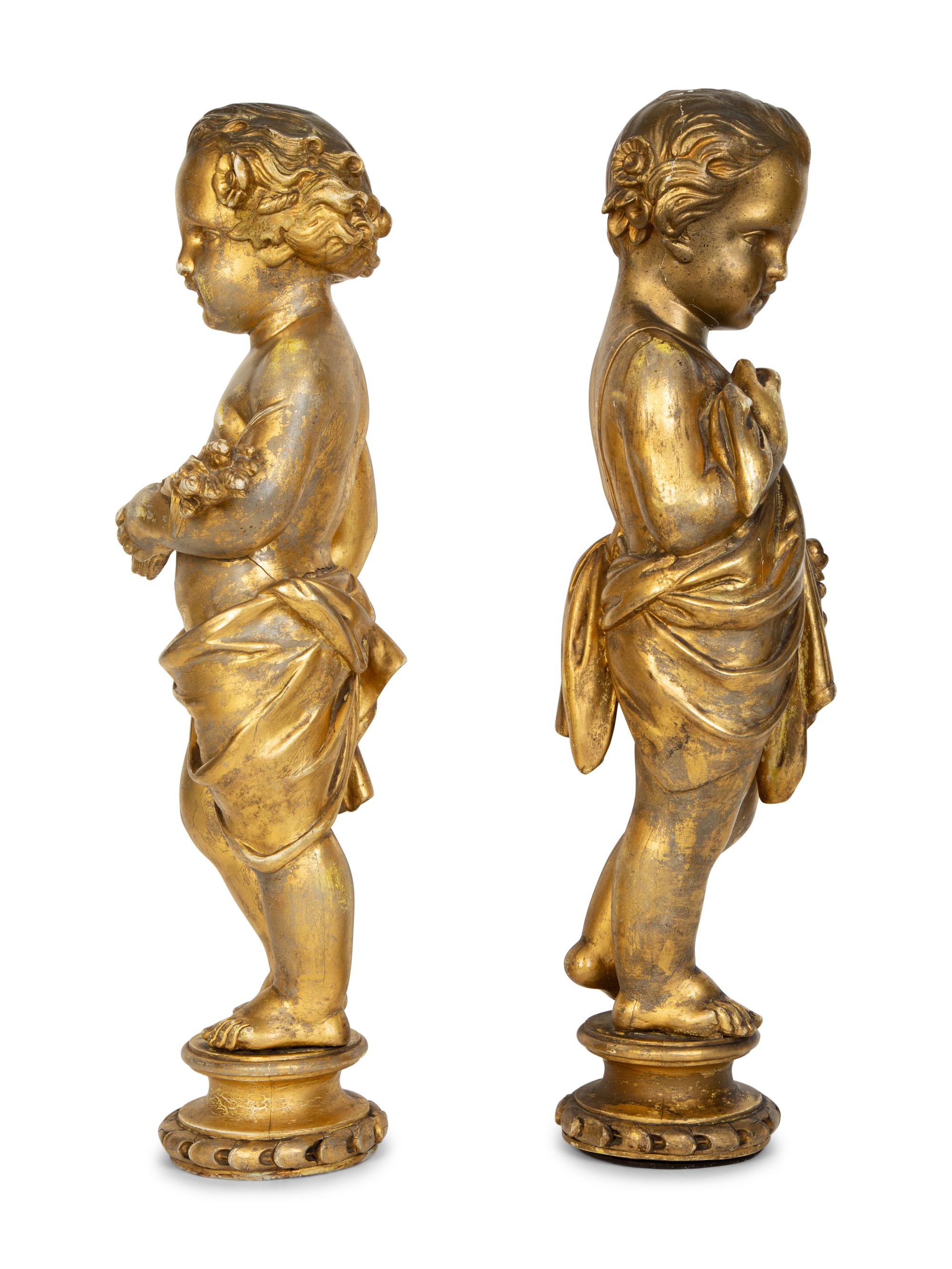 A Pair of Continental Giltwood Figures of Putti