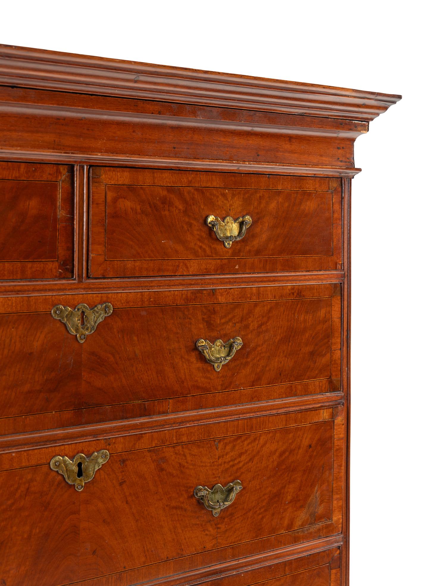 A Queen Anne Figured and Veneered Walnut Flat-Top High Chest Of Drawers