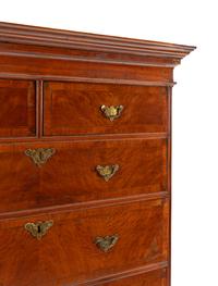 A Queen Anne Figured and Veneered Walnut Flat-Top High Chest Of Drawers