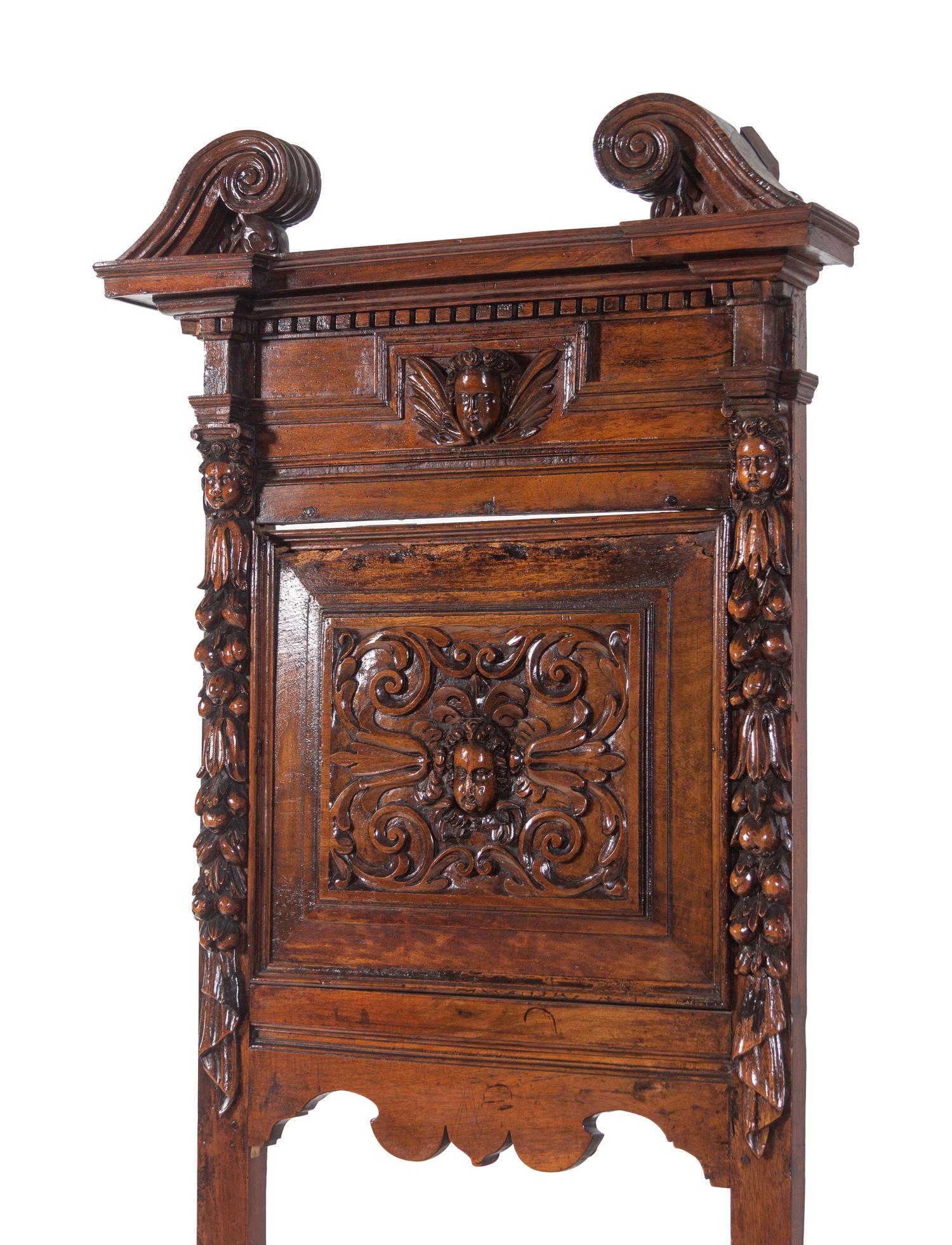A Pair of Renaissance Revival Carved Walnut Hall Chairs