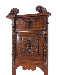 A Pair of Renaissance Revival Carved Walnut Hall Chairs