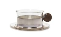 A German Art Deco Silver-plate and Glass Teacup and Saucer Diameter of saucer 5 1/8 inches.
