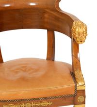 An Empire Gilt Bronze Mounted Mahogany and Parcel Gilt Fauteuil de Bureau