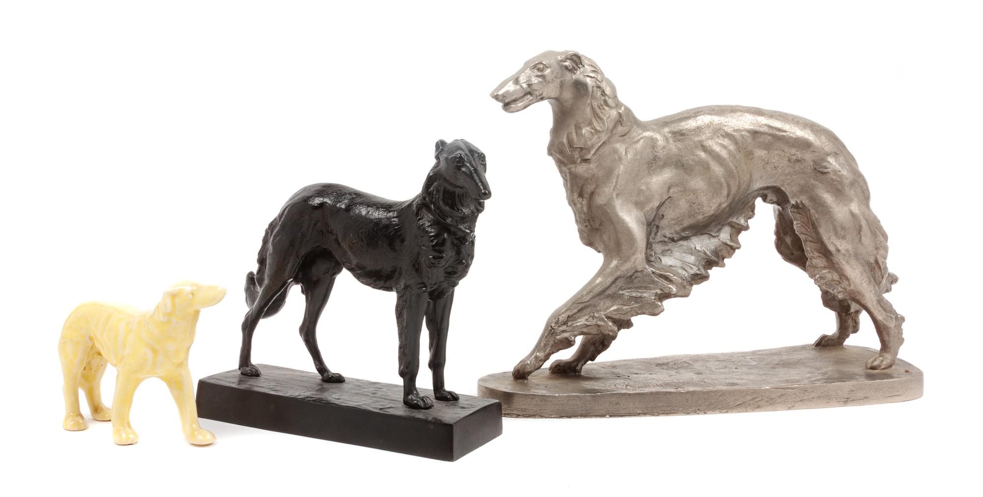 A Group of Three Borzoi Figures Width of widest 13 inches.