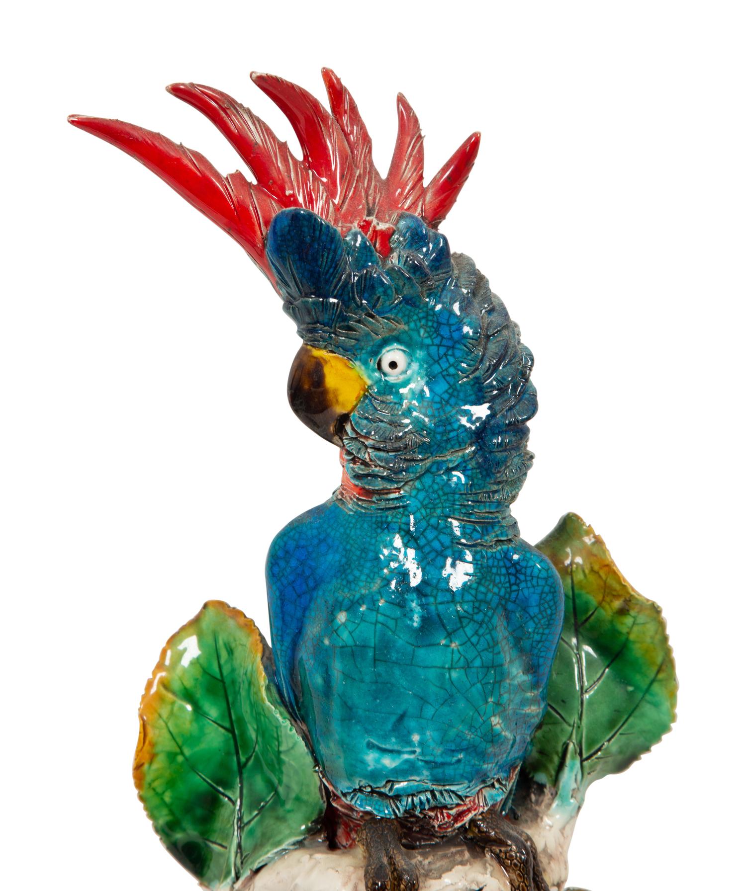 A Pair of Polychrome Glazed Earthenware Parrot Wall Appliqués