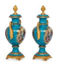A Pair of Sèvres Style Porcelain Urns