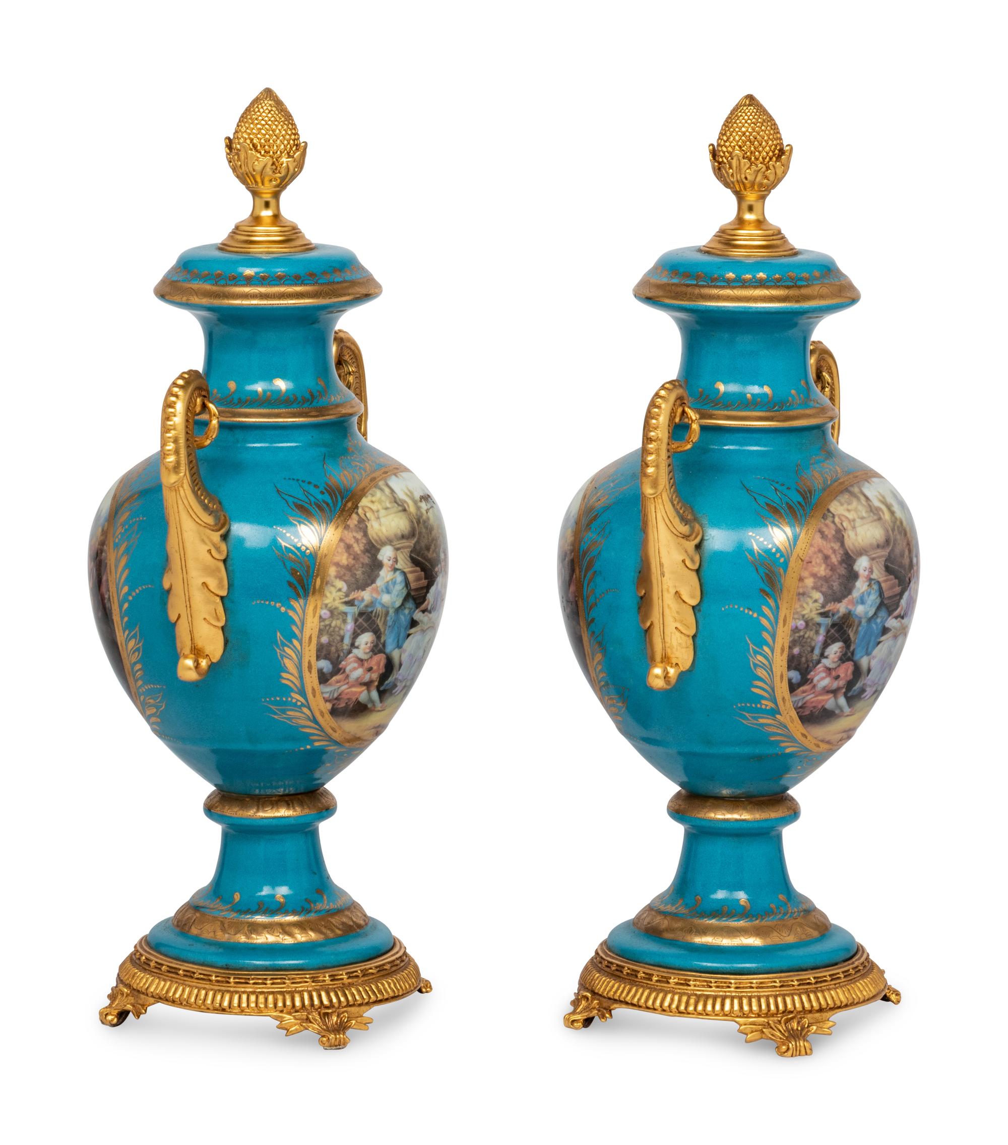 A Pair of Sèvres Style Porcelain Urns