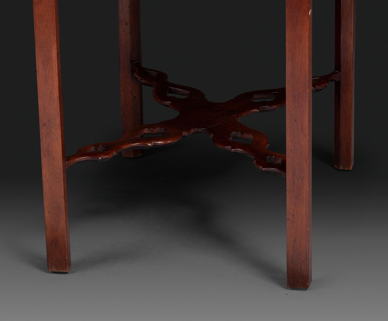 A Late Chippendale Carved and Figured Mahogany Stretcher-Base Pembroke Table