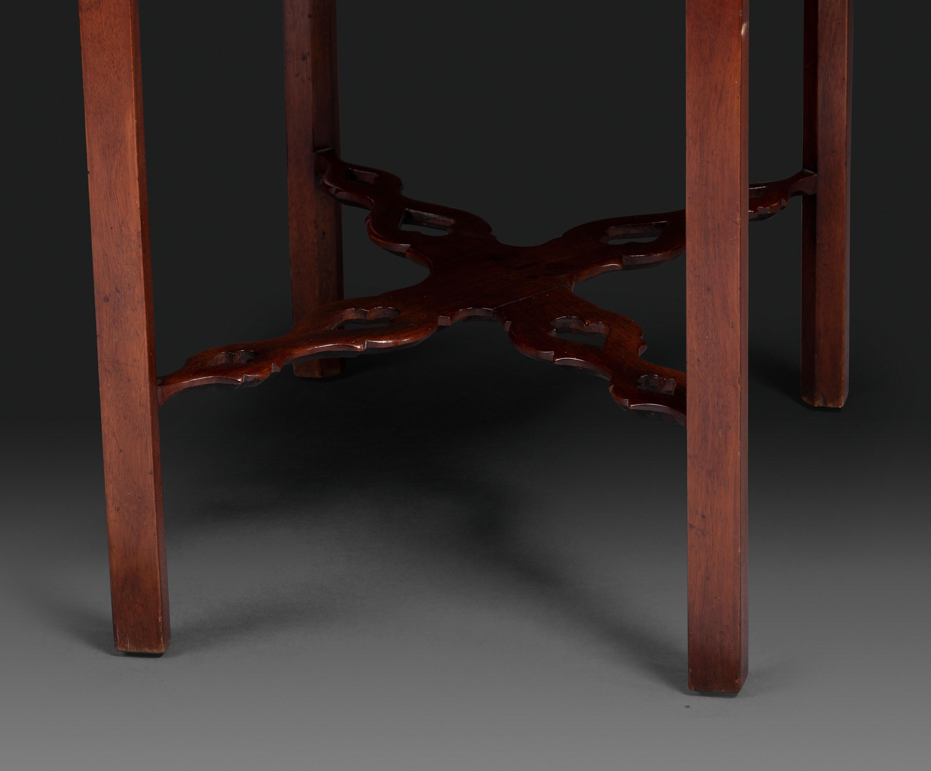 A Late Chippendale Carved and Figured Mahogany Stretcher-Base Pembroke Table