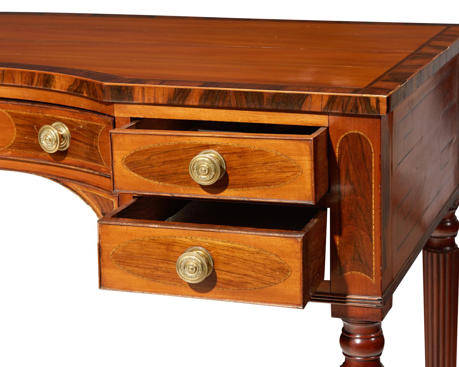 A George III inlaid mahogany, satinwood, and kingwood writing table, circa 1810