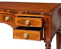 A George III inlaid mahogany, satinwood, and kingwood writing table, circa 1810