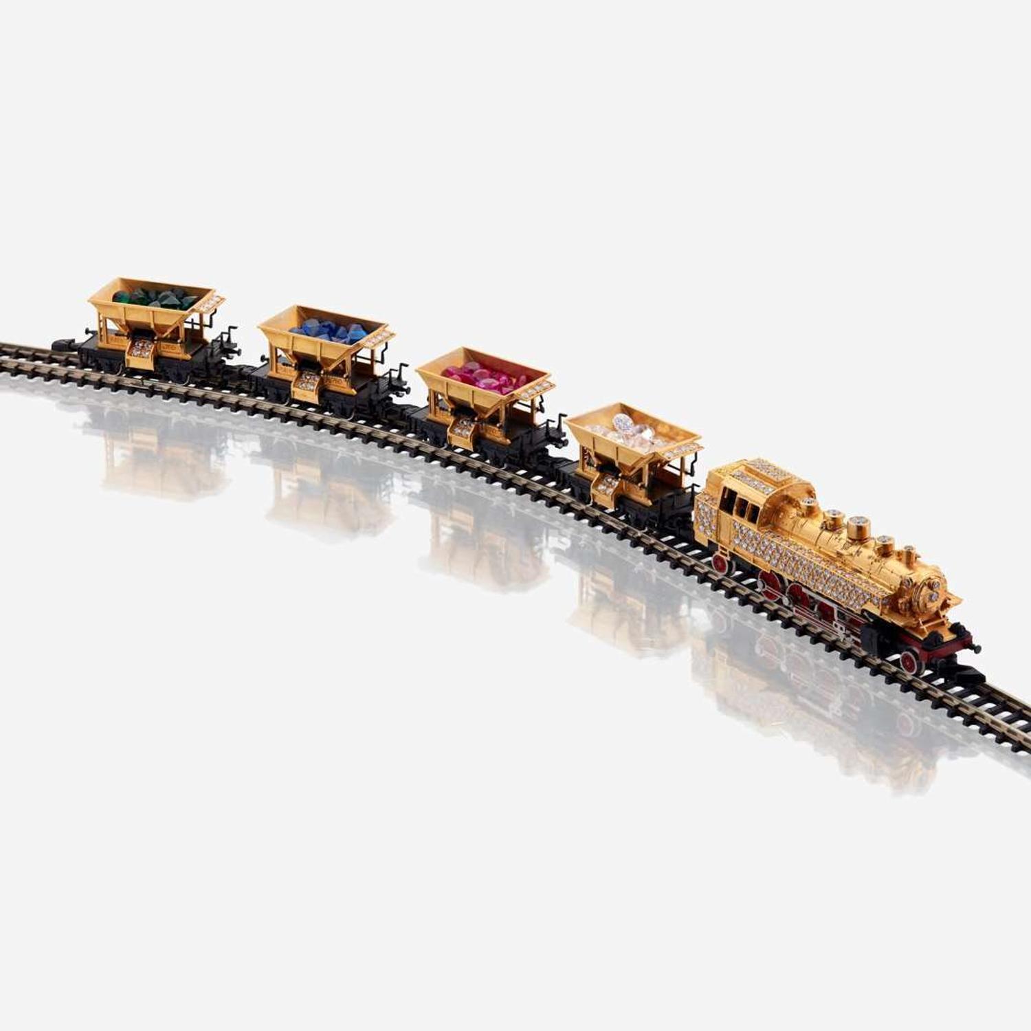 An eighteen karat gold, diamond, and synthetic gemstone model train No. 12, Halberstadt Märklin