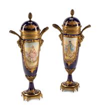 A Pair of Gilt Bronze Mounted Sèvres Style Porcelain Urns