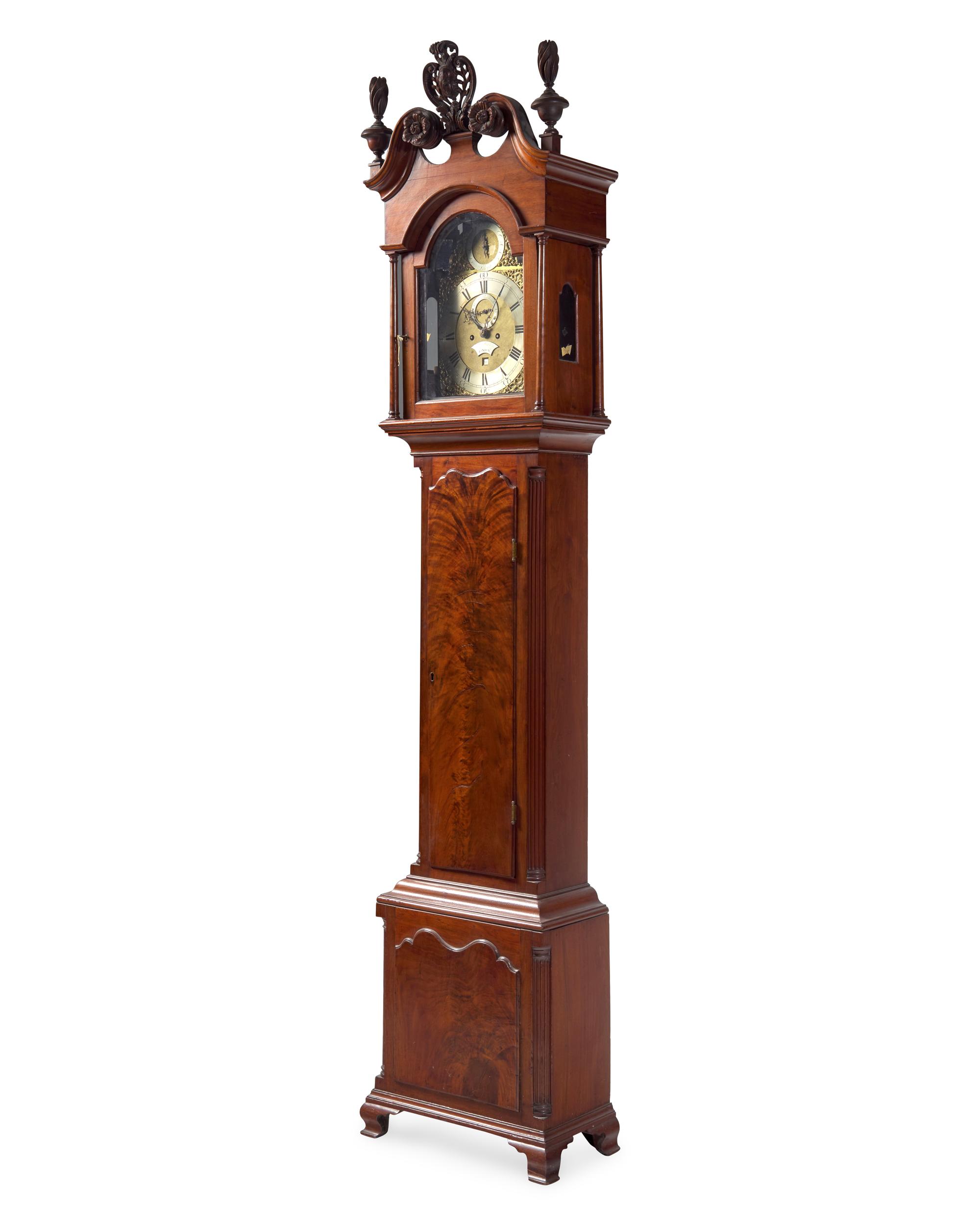 A Chippendale Carved and Figured Walnut Tall Case Clock